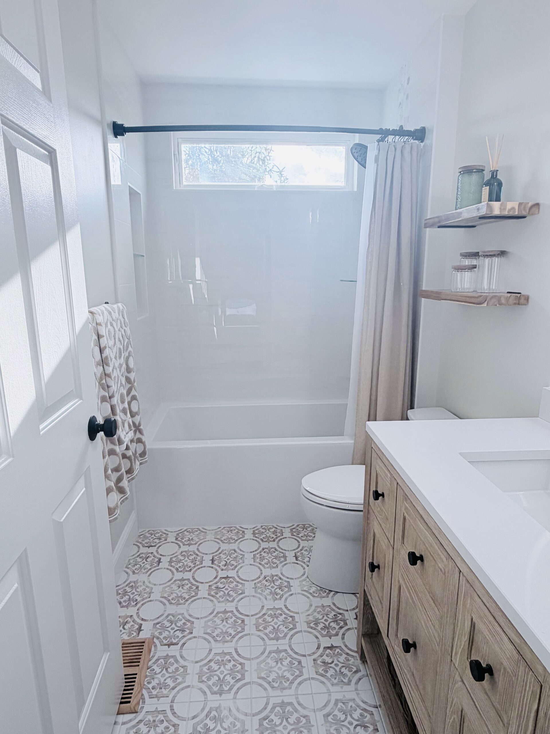 Completed bathroom remodel in West Chester PA by Jacoby Home Improvements with custom tile shower and modern vanity