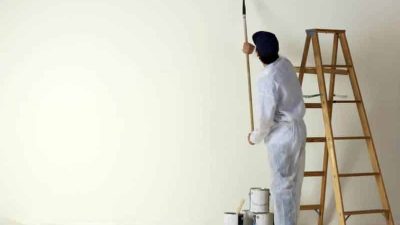 painting-contractor-painting-with-a-roller.jpg